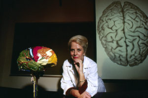 Marian Diamond poses for a photograph with model brains at University of California, Berkeley in Berkeley, Calif. on Aug. 1, 1984.